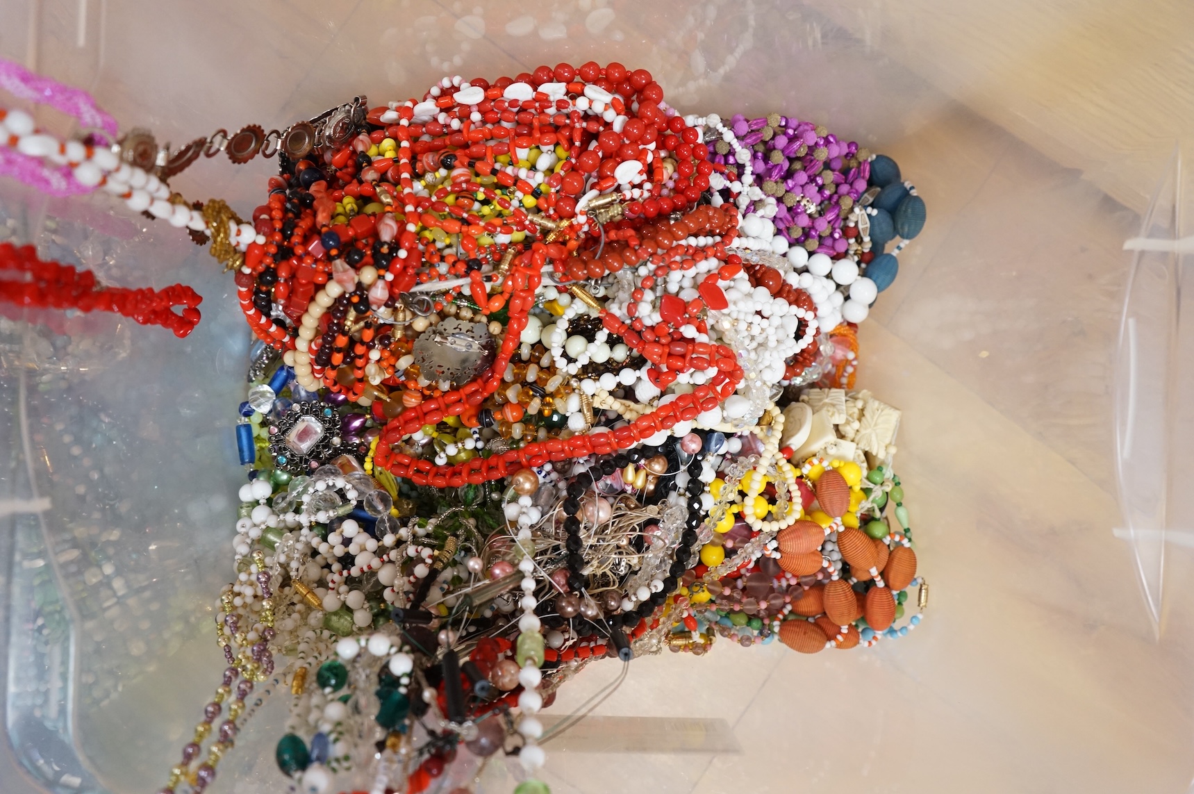 A large collection of glass bead necklaces